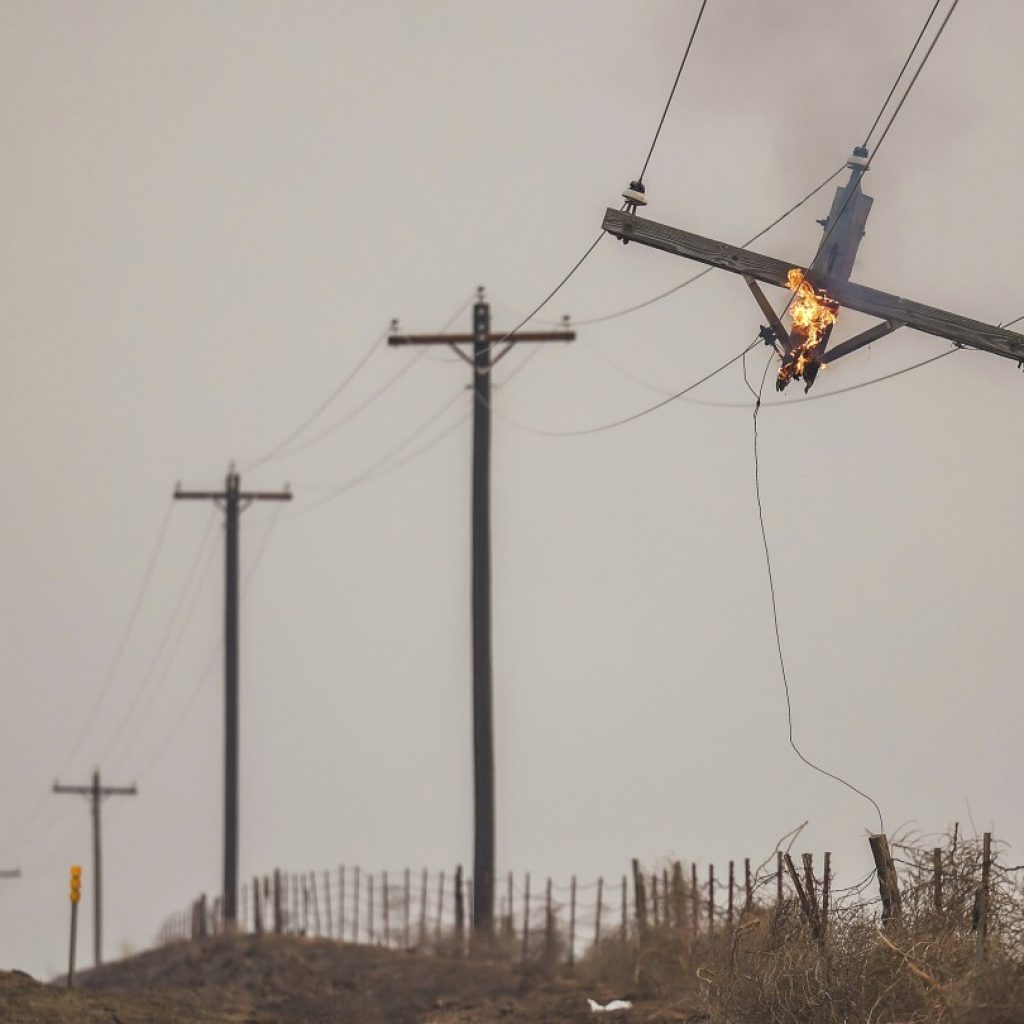 Firefighters seek to corral massive Texas wildfires before weekend of higher temperatures and winds