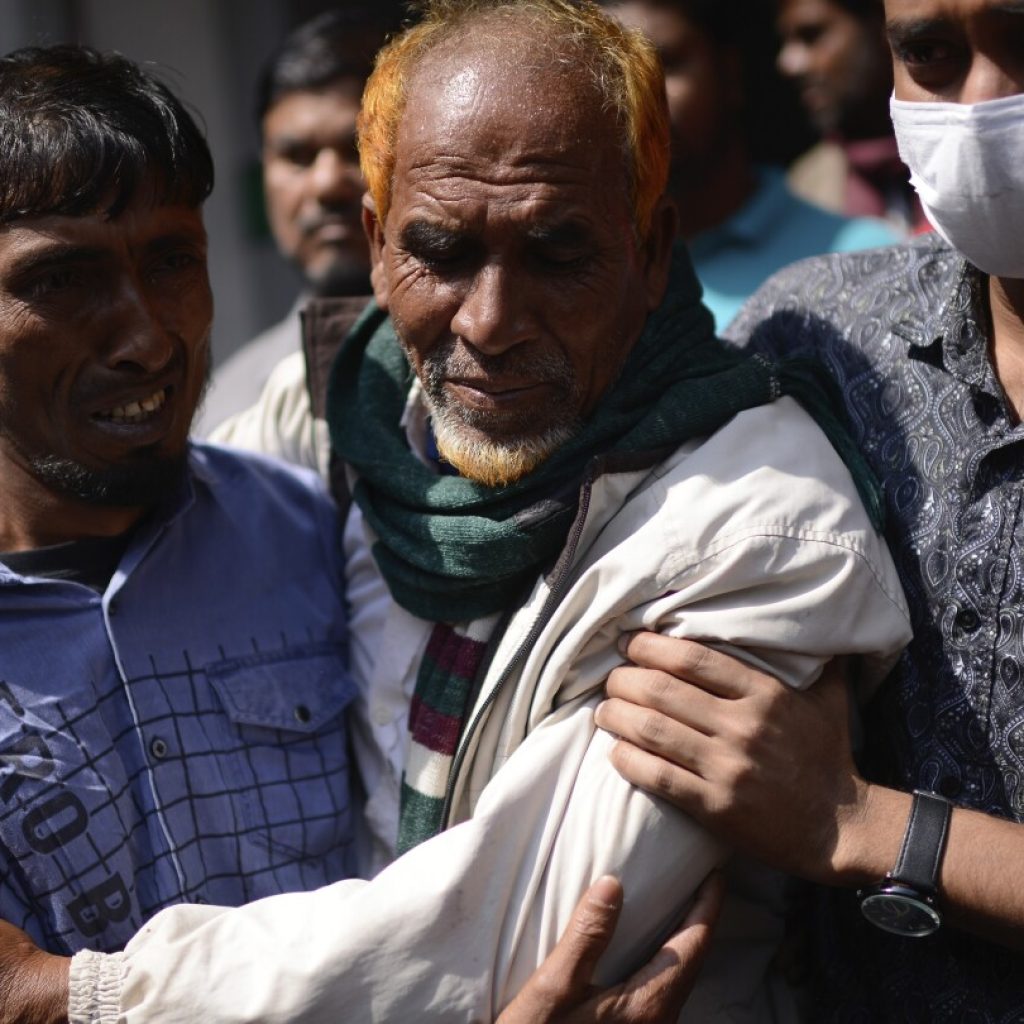 Bangladeshi leader says a shopping mall that caught fire had no emergency exits. Death toll climbs