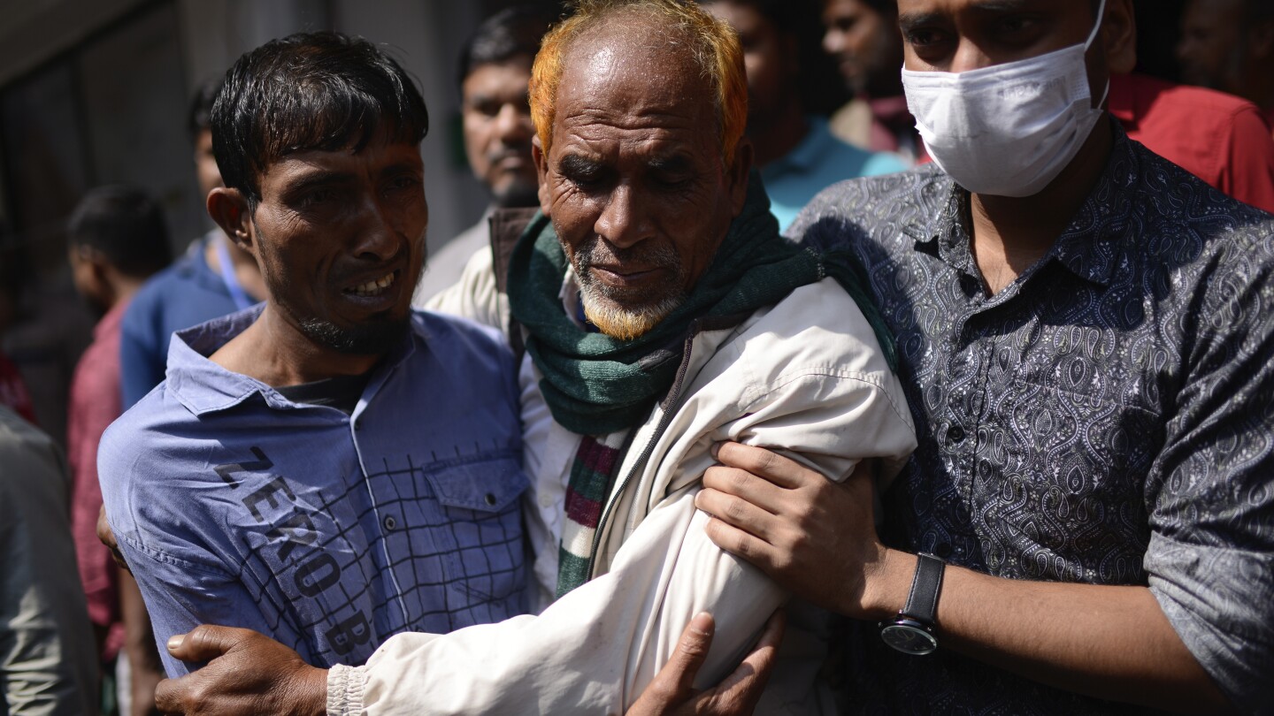 Bangladeshi leader says a shopping mall that caught fire had no emergency exits. Death toll climbs