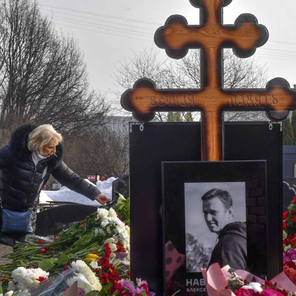 Navalny’s mother brings flowers to his grave a day after thousands attended his funeral in Moscow