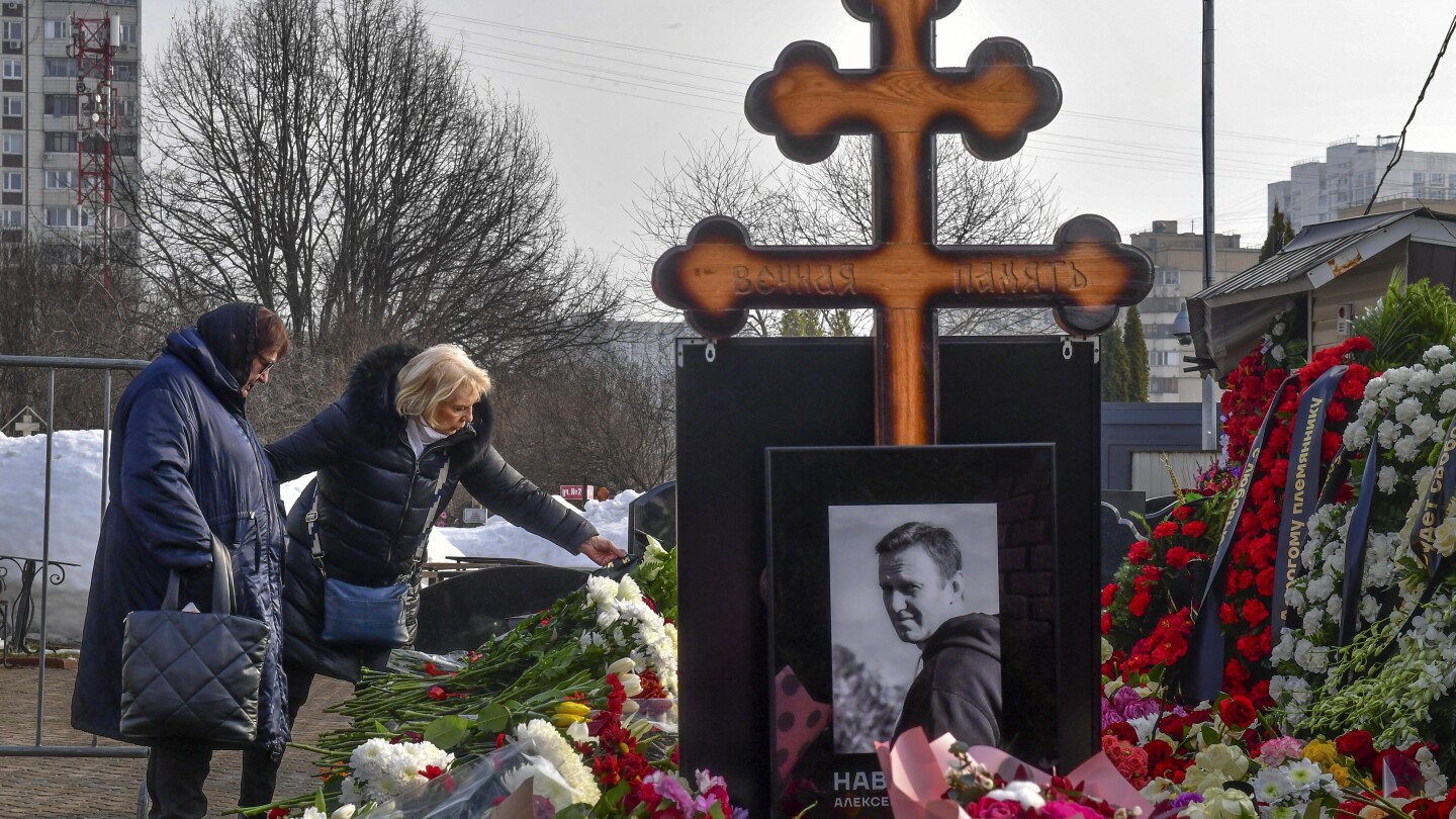 Navalny’s mother brings flowers to his grave a day after thousands attended his funeral in Moscow