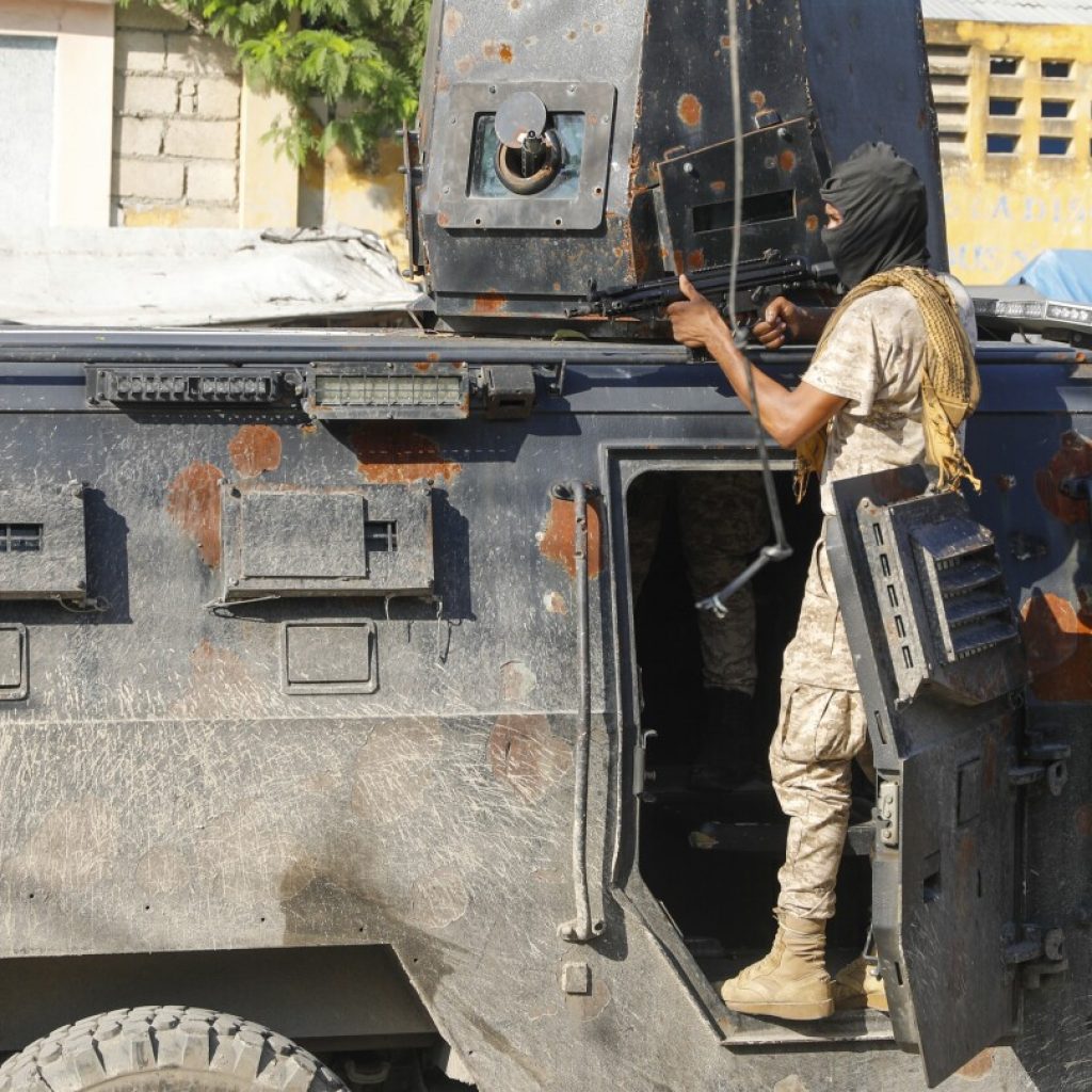 Police in Haiti struggle against gangs storming prison in latest surge of violence