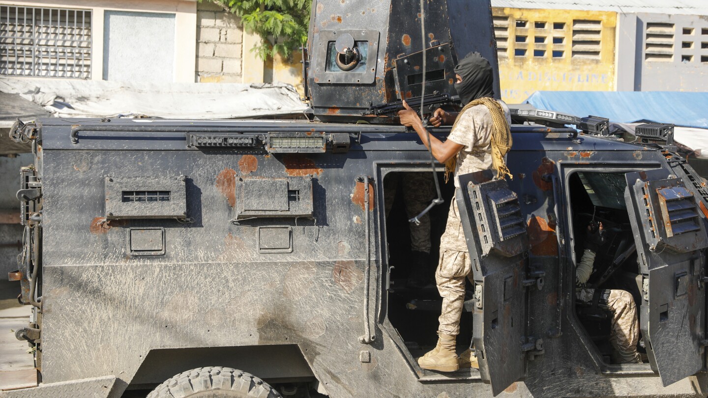 Police in Haiti struggle against gangs storming prison in latest surge of violence