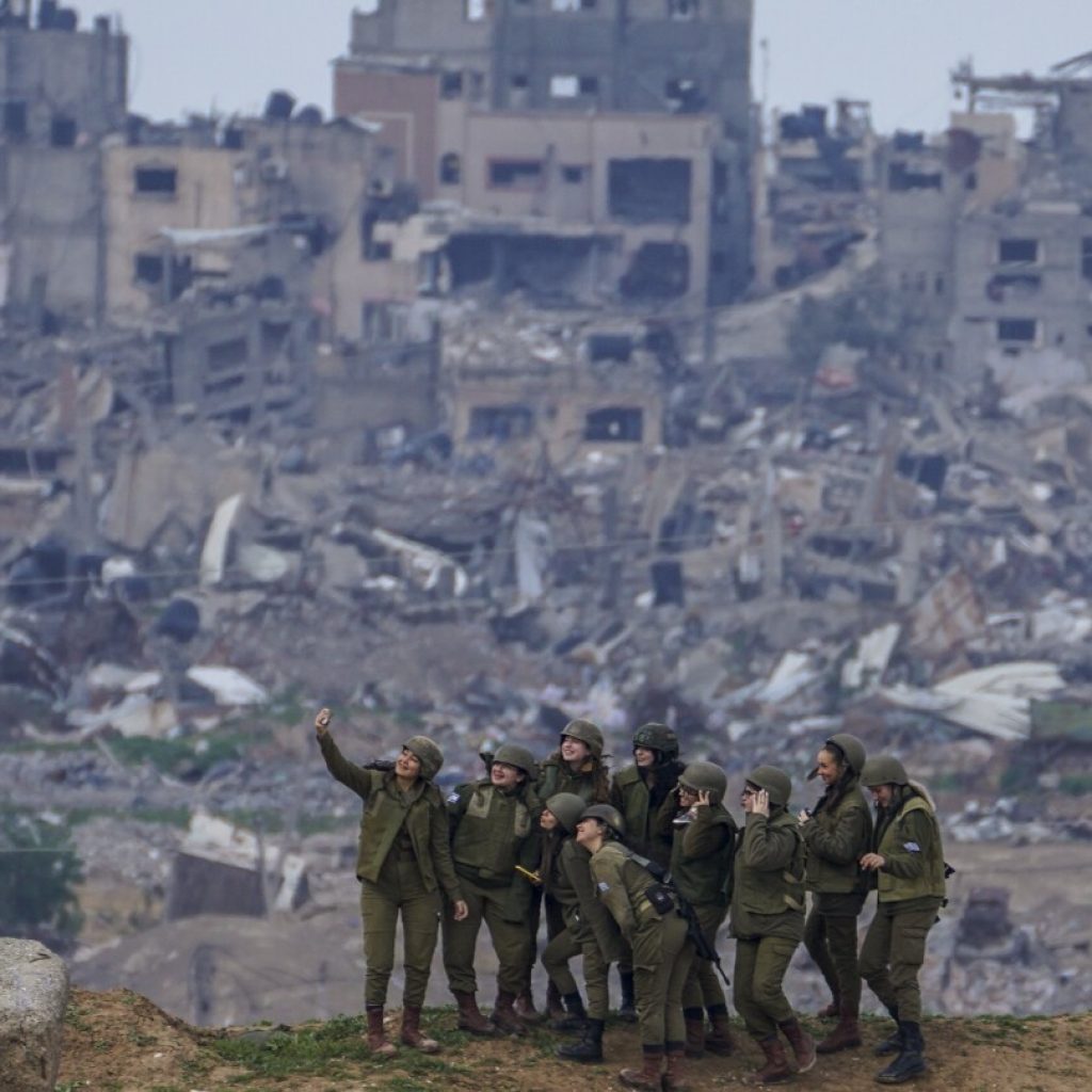 How this AP photographer caught this image of Israeli soldiers taking a selfie at the Gaza border