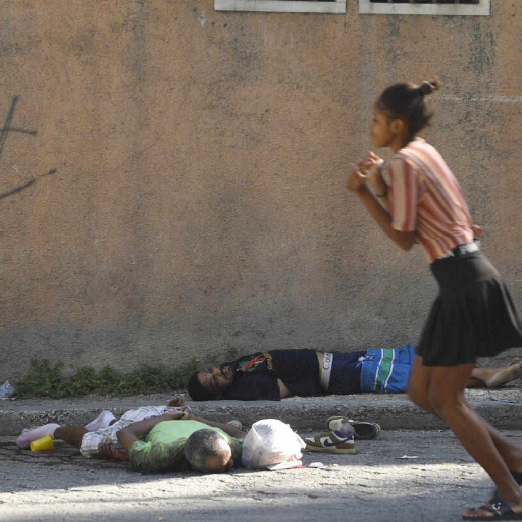 Haiti orders nightly curfew trying to restore calm after a weekend of violence and prison break