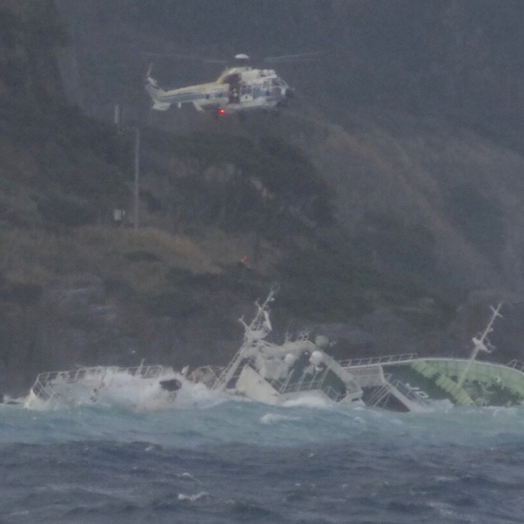 24 fishermen rescued from half-submerged ship in rough seas off Japanese island, but 1 found dead