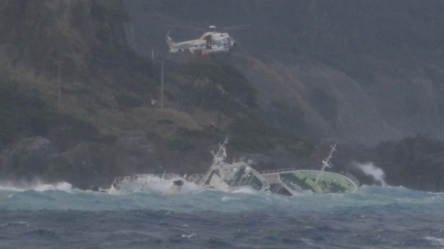 24 fishermen rescued from half-submerged ship in rough seas off Japanese island, but 1 found dead