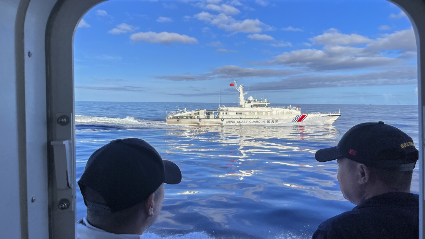 Chinese coast guard blocks vessels off South China Sea shoal, causing a collision, Philippines says