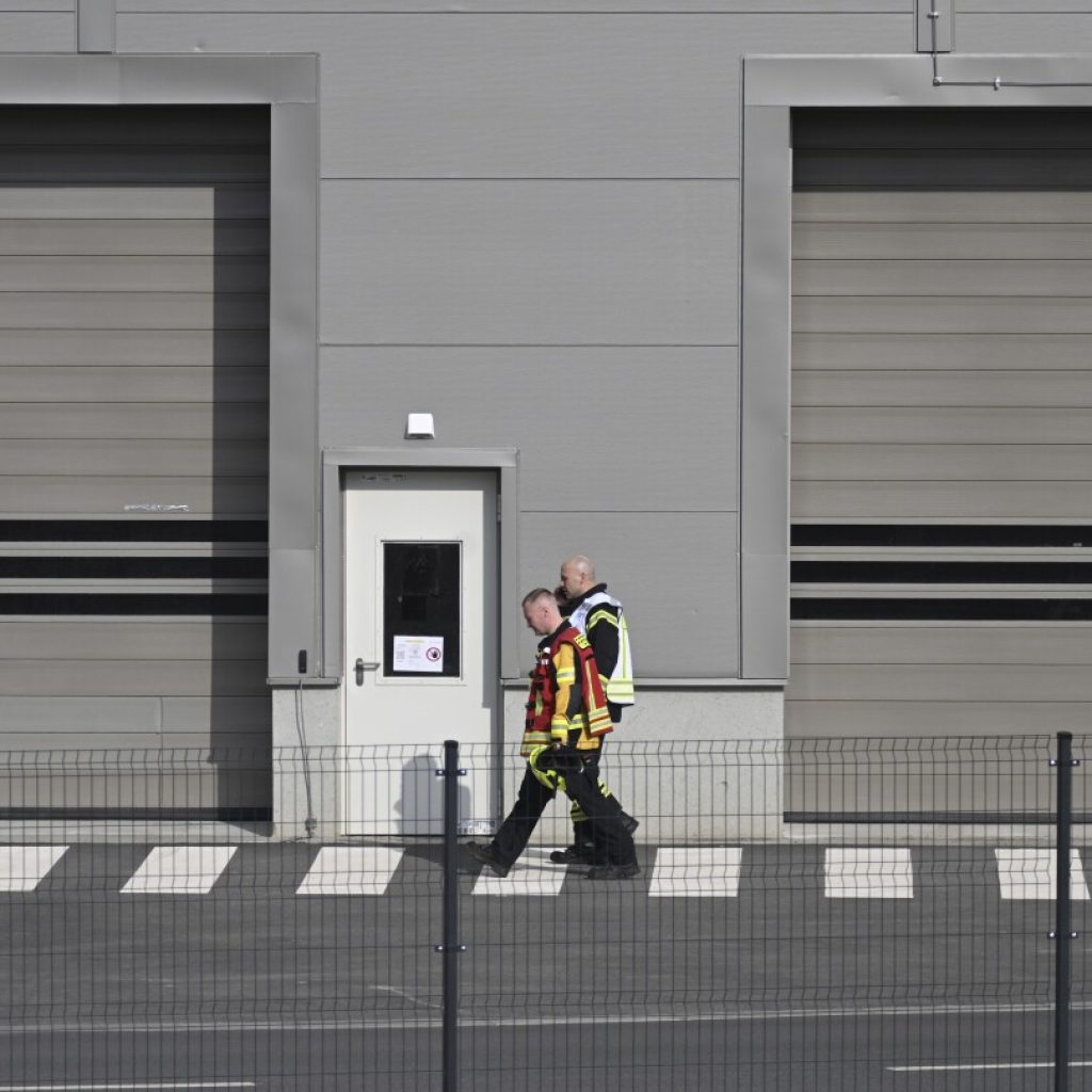 Production at a Tesla plant near Berlin is halted after a power outage. Officials suspect arson