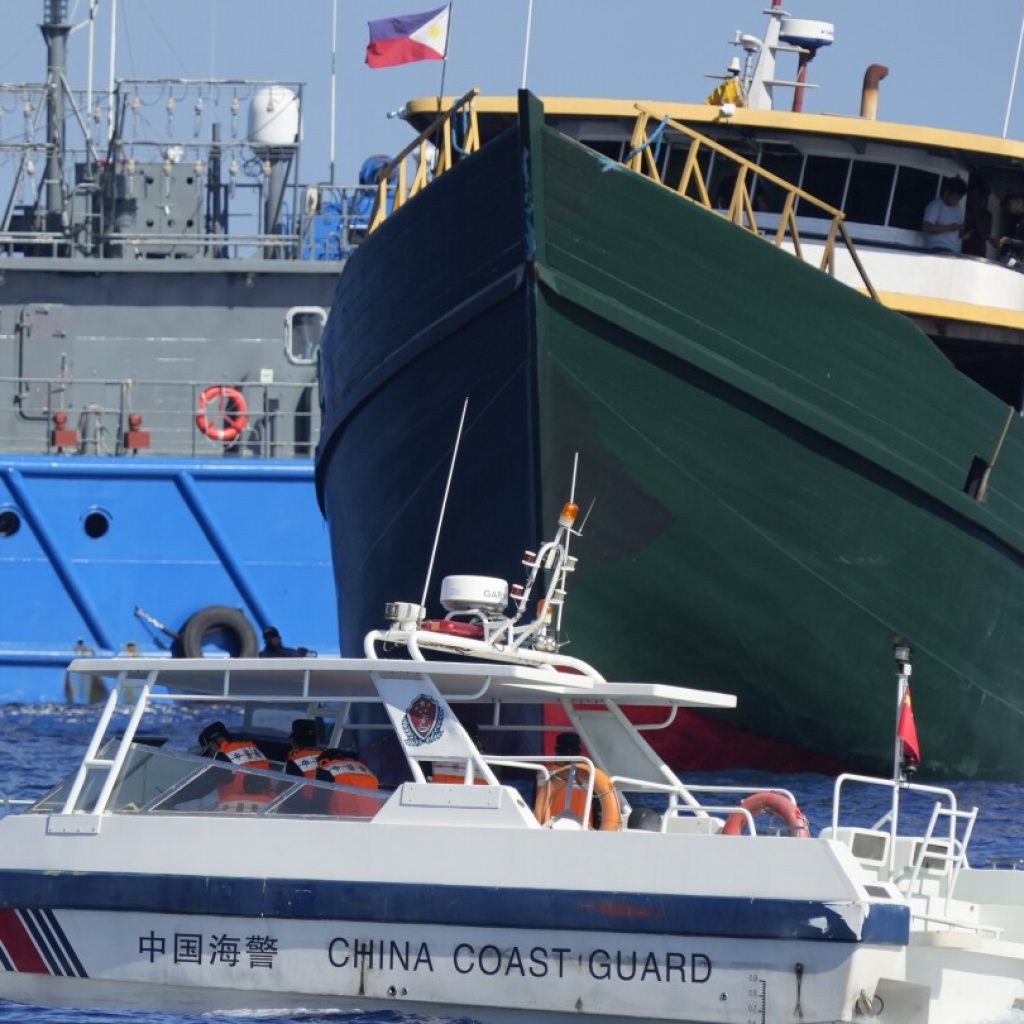 The Philippines says it won’t let China remove a Filipino military outpost on a disputed shoal