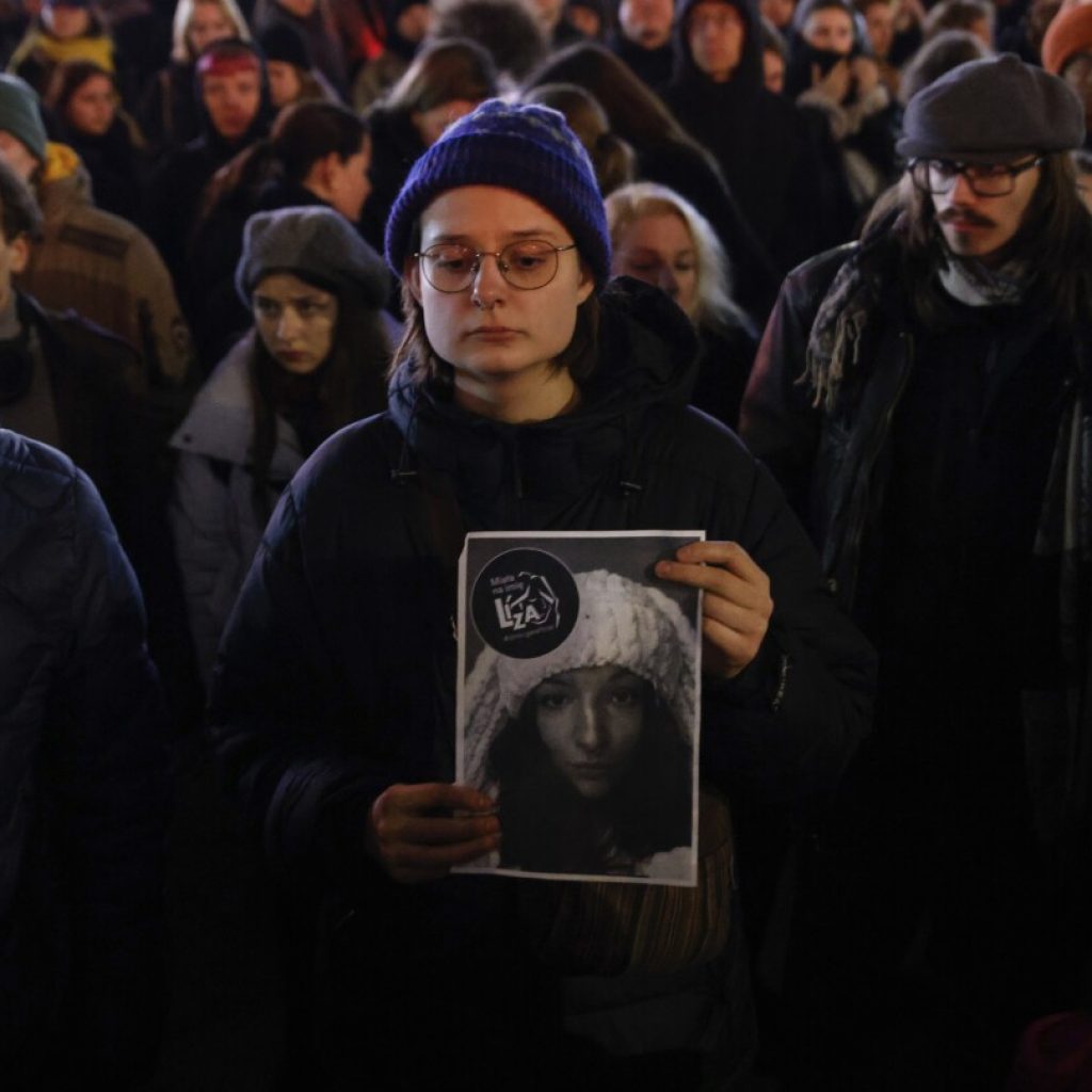 Mourners honor woman who was raped and killed in Poland’s capital after fleeing Belarus