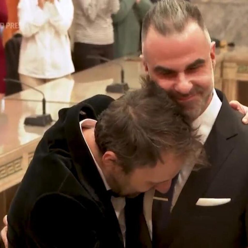 A Greek novelist and a lawyer are the first same-sex couple to wed at Athens city hall | AP News