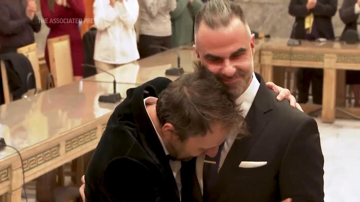 A Greek novelist and a lawyer are the first same-sex couple to wed at Athens city hall | AP News