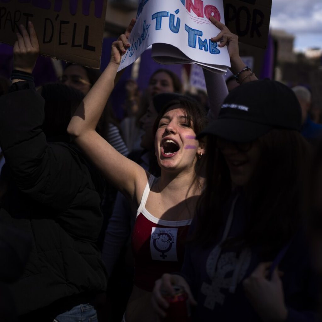AP PHOTOS: Women mark International Women’s Day by taking part in efforts to combat discrimination