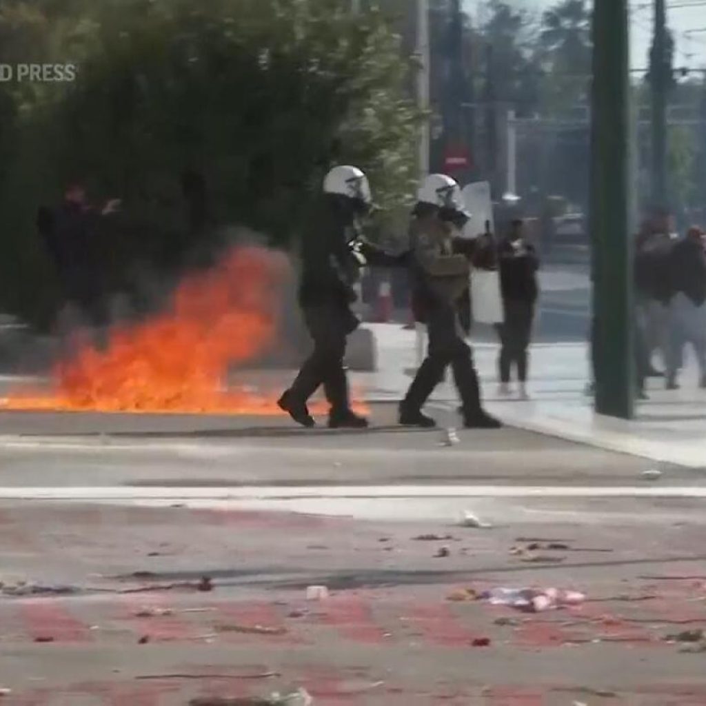 Greek police clash with protesters outside parliament during debate on private universities | AP News