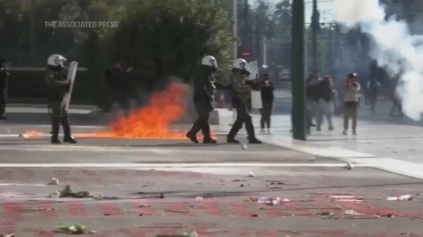 Greek police clash with protesters outside parliament during debate on private universities | AP News