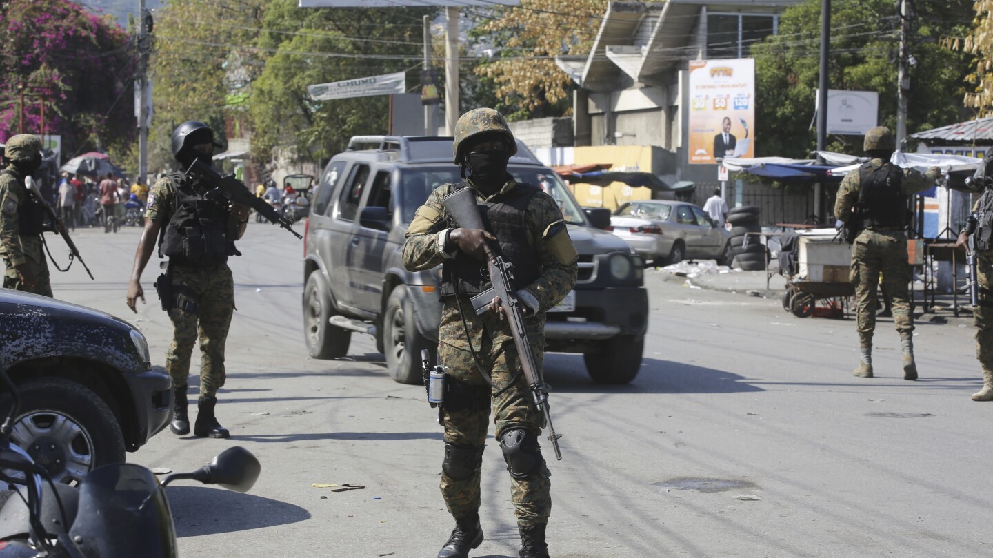 US forces fly in to beef up security at embassy in Haiti and evacuate nonessential personnel