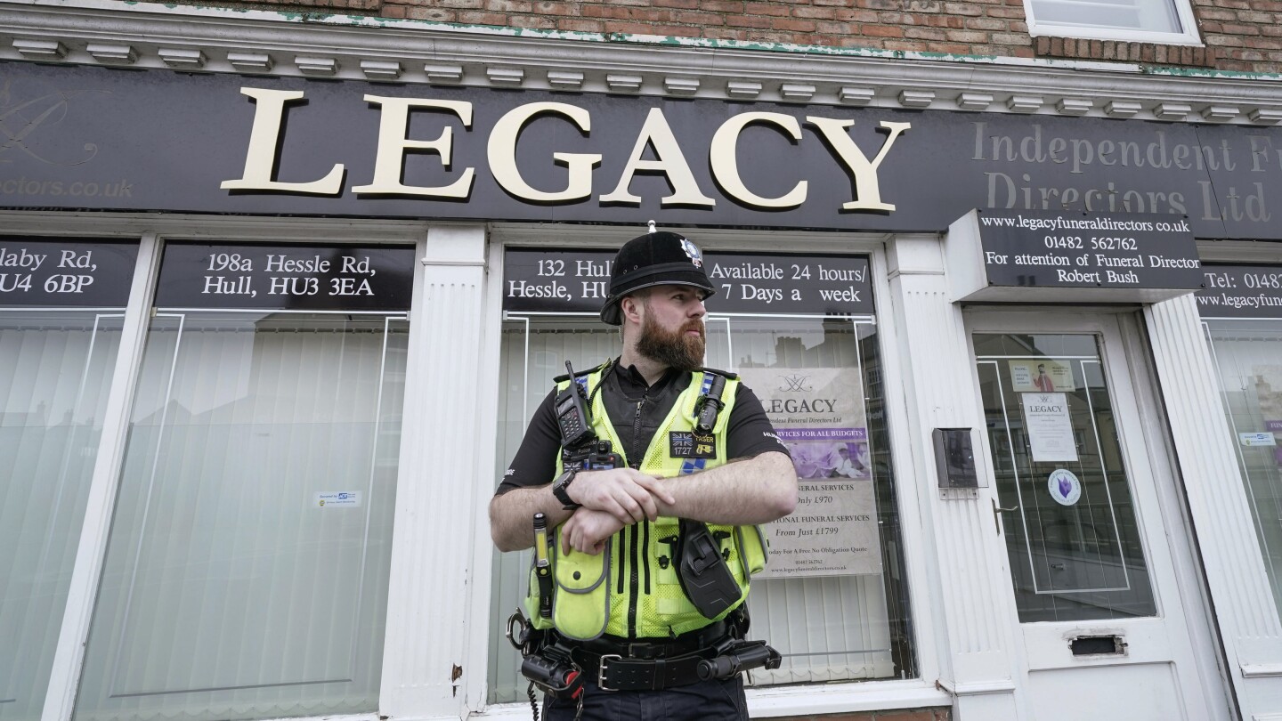 Police remove 34 bodies from English funeral home and arrest 2 for fraud and preventing burial