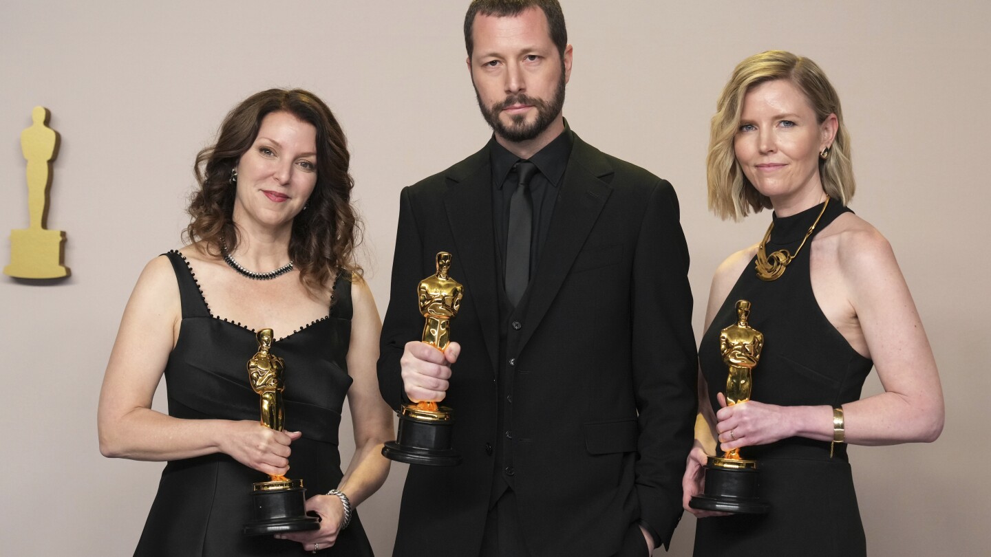 Ukraine’s first Oscar hailed as reminder of war’s horrors as Russian drones strike buildings