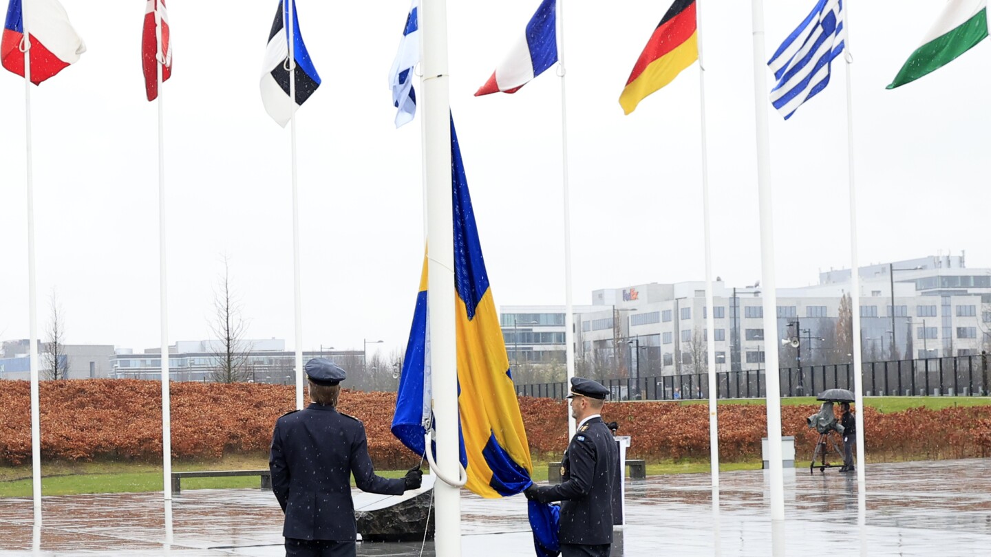 Sweden’s flag raised at NATO headquarters, cementing its place as the 32nd alliance member