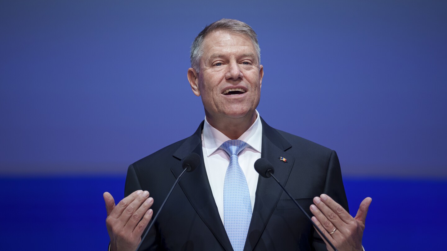 Romania’s president announces his bid to become the NATO military alliance’s next leader