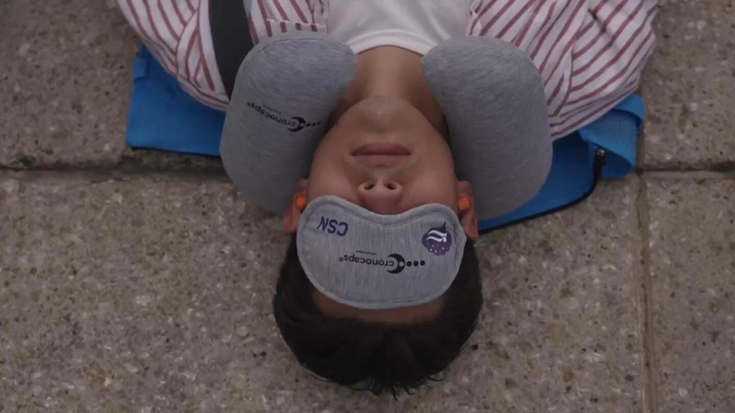 Hundreds of people in Mexico City stretch out for ‘mass nap’ to commemorate World Sleep Day | AP News