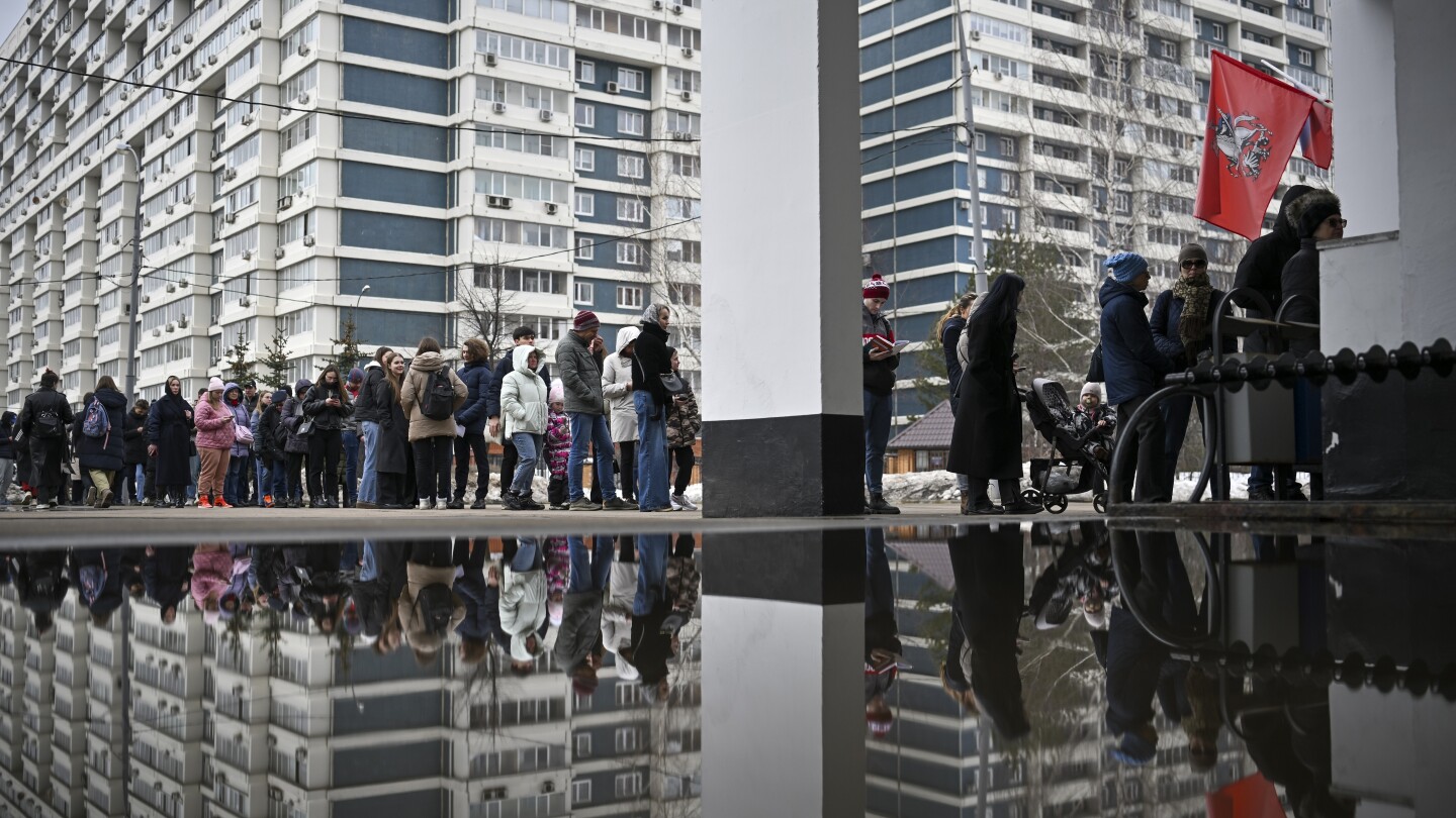 AP PHOTOS: Russians vote in election dominated by Putin