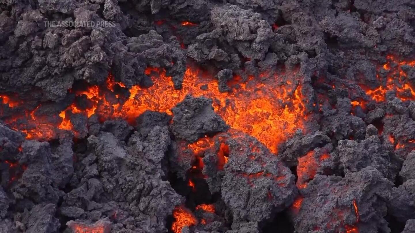 Lava from latest volcanic eruption in Iceland flows toward evacuated town | AP News