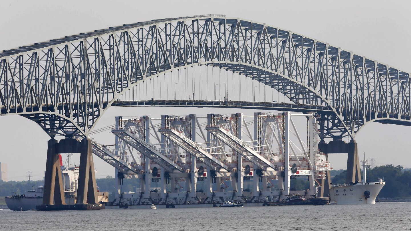 Cargo ship hits Baltimore’s Key Bridge, causing it to collapse. Rescuers search for 7 in water