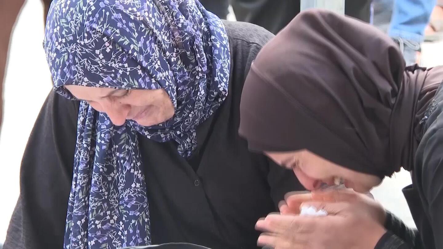 Relatives mourn over remains of Palestinians killed in Israeli airstrike on residential building in Rafah | AP News