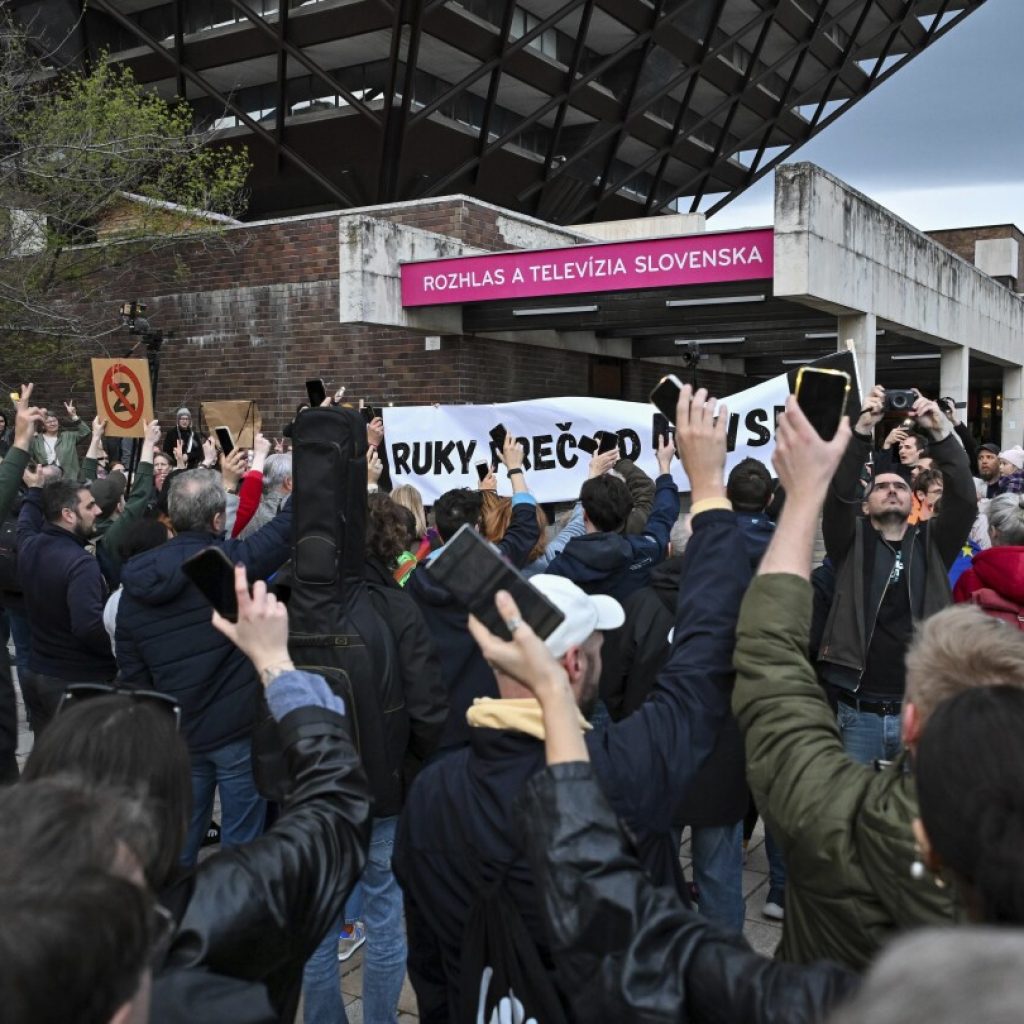People form a human chain around Slovakia’s public broadcaster that government wants to take over