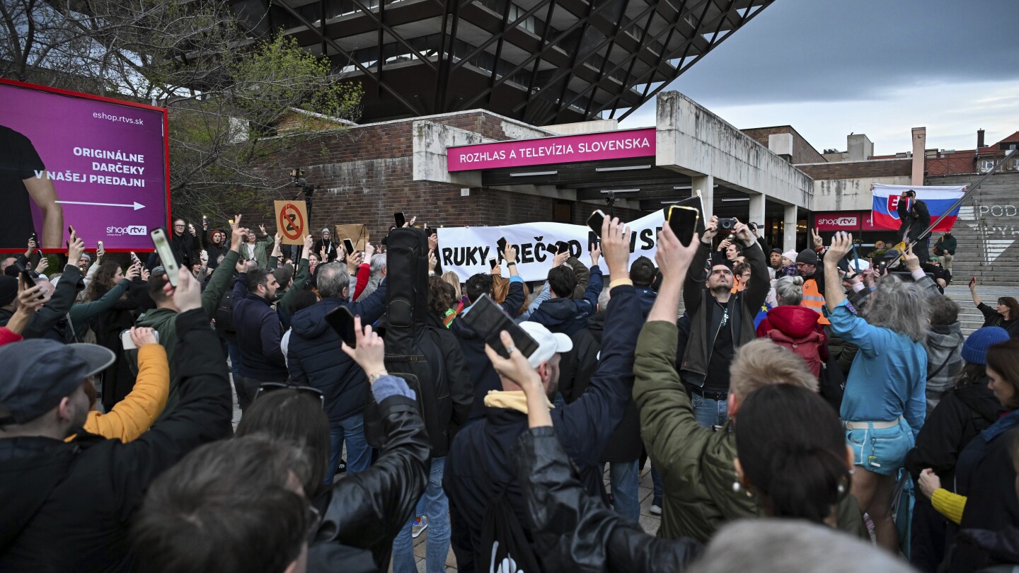 People form a human chain around Slovakia’s public broadcaster that government wants to take over