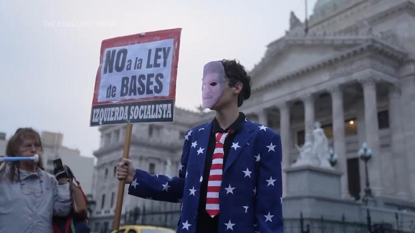 Argentines protest over a tax bill while it is discussed in Congress