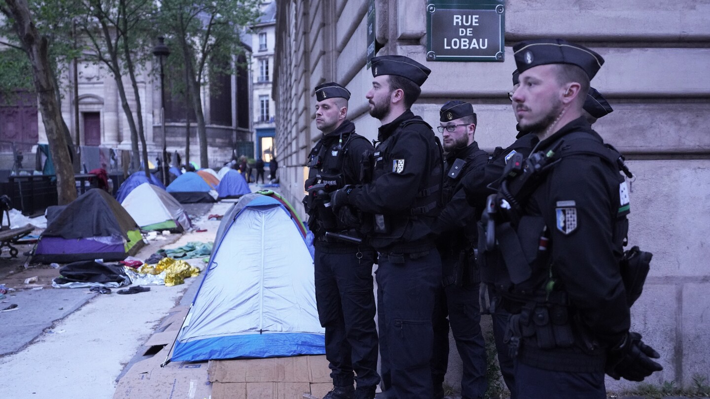 Ahead of the Paris Olympics, police clear a migrant camp near City Hall