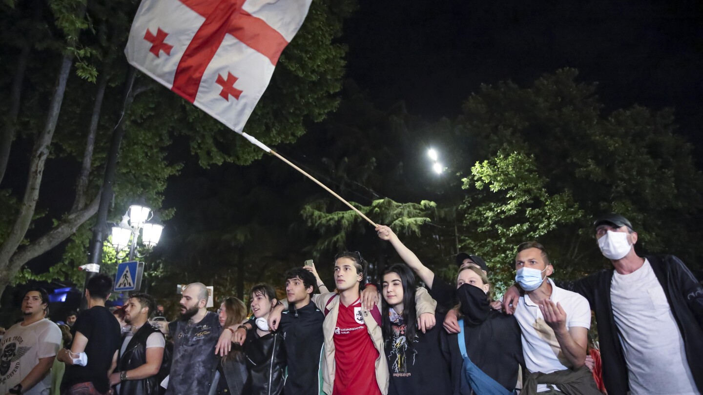 Georgia parliament cancels session after building damaged during huge protests