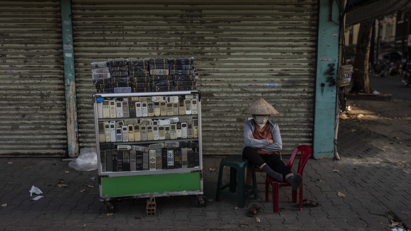 E-waste is overflowing landfills. At one sprawling Vietnam market, workers recycle some of it