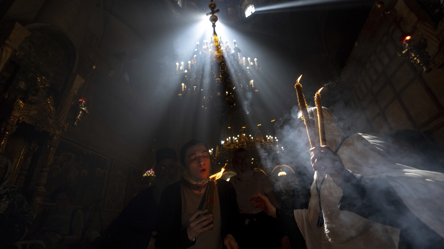 Cheers and flames as Orthodox worshipers greet the ancient ceremony of the ‘Holy Fire’