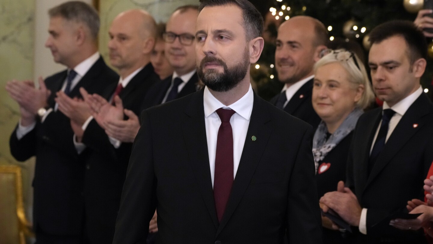 Polish defense minister fends off criticism after he says he keeps an emergency backpack ready