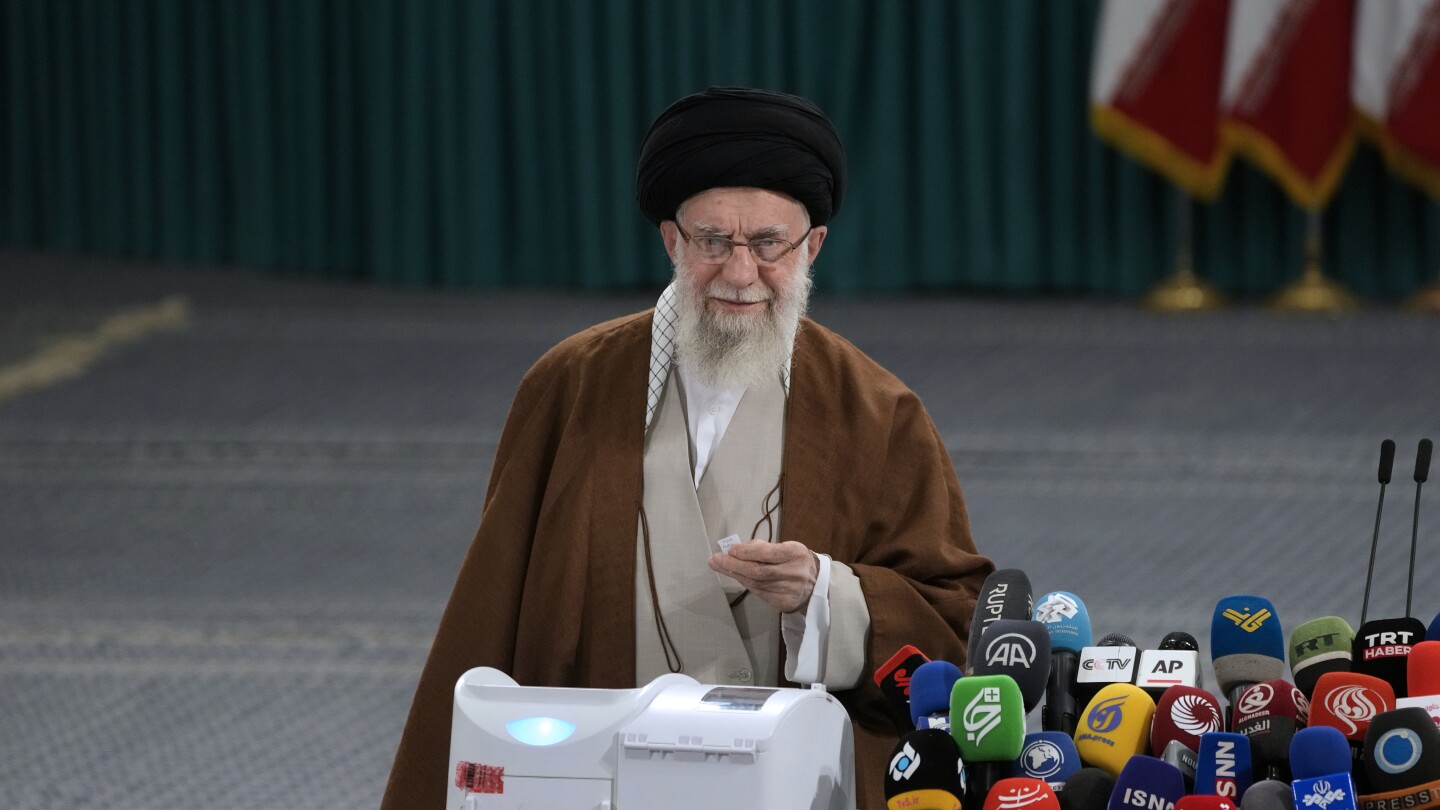 Iranians vote in parliamentary runoff election after hard-liners dominate initial balloting