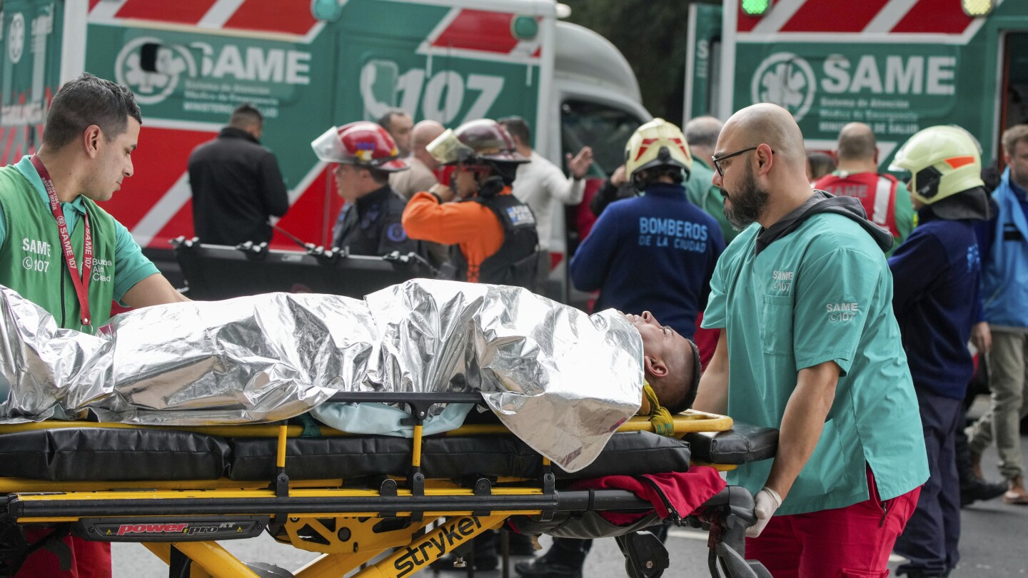 A train in central Buenos Aires strikes a boxcar on the track, injuring dozens