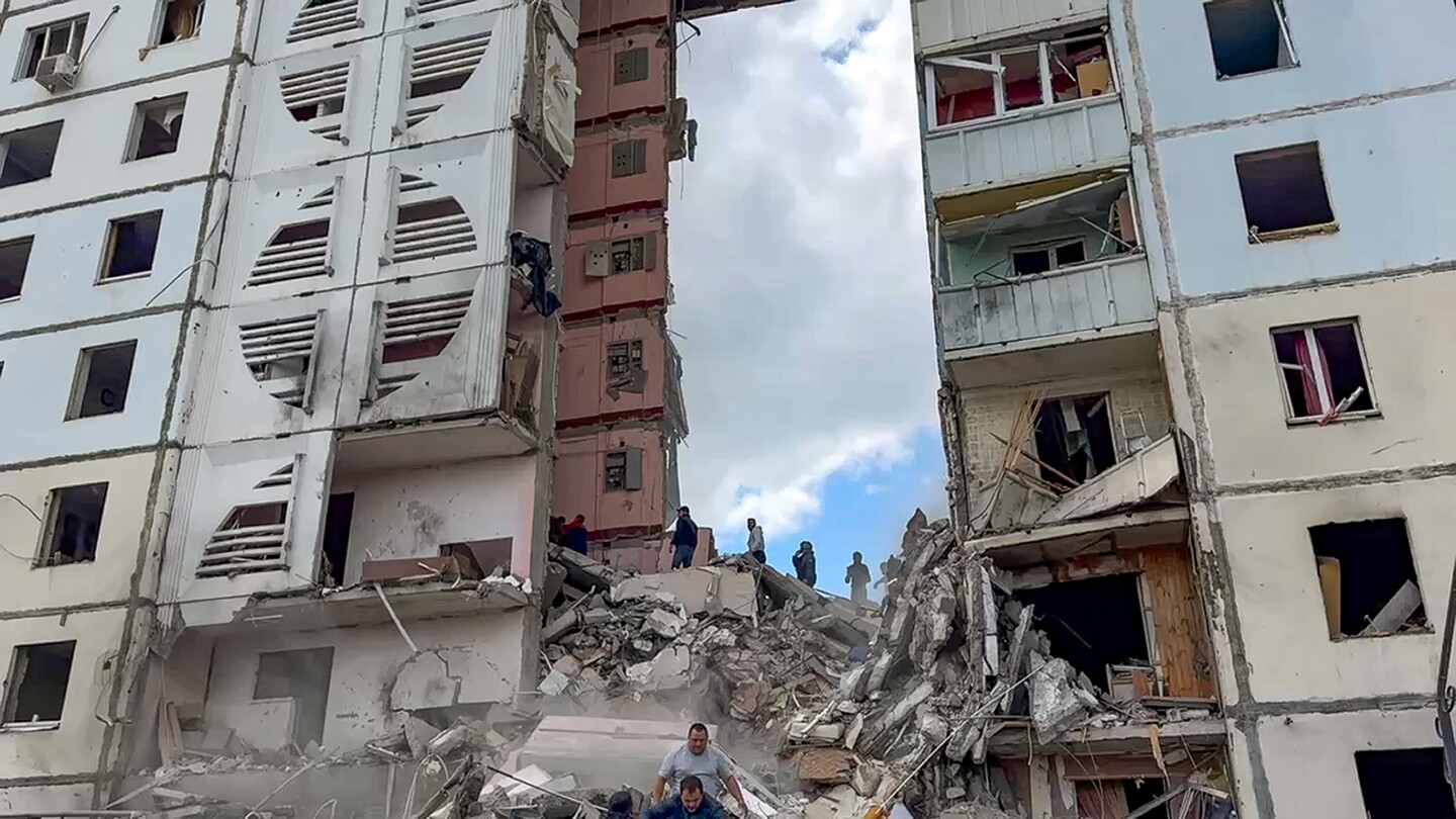 An apartment block collapses in a Russian border city after heavy shelling, with deaths reported