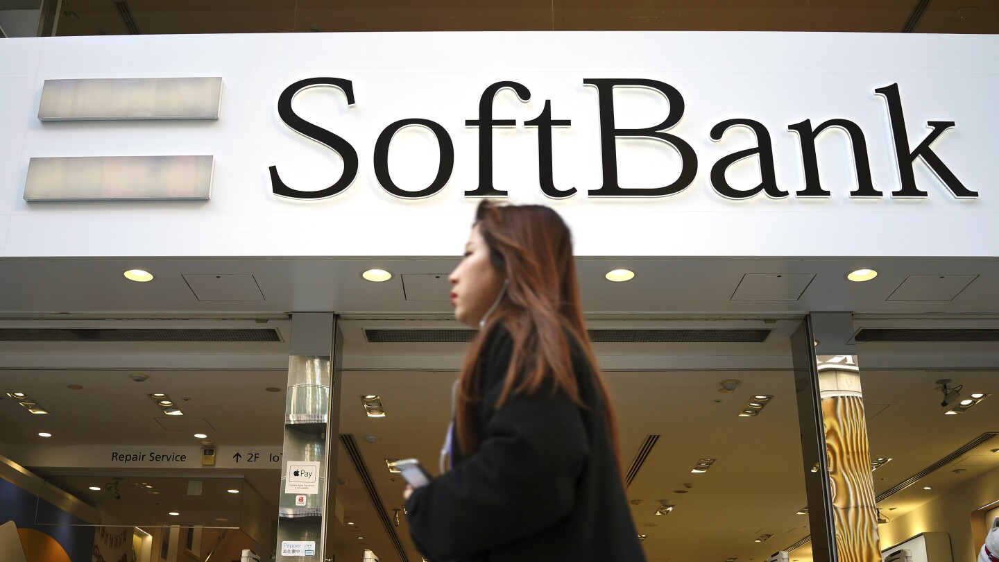 Japan’s SoftBank Group trims investment losses but remains in red for fiscal year