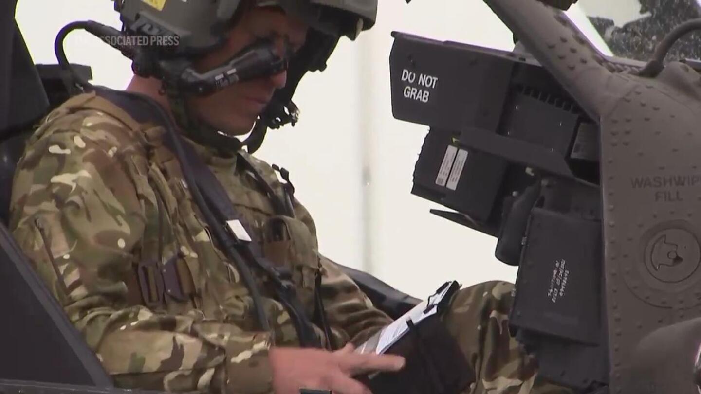 Prince William takes to the skies in Apache helicopter after becoming colonel-in-chief of Army Air Corps | AP News