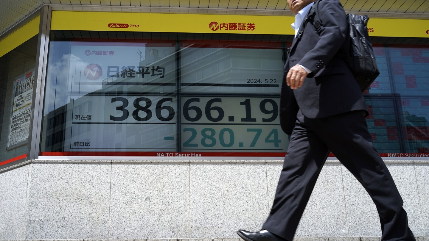 Stock market today: Asian shares edge lower after Wall Street sets more records