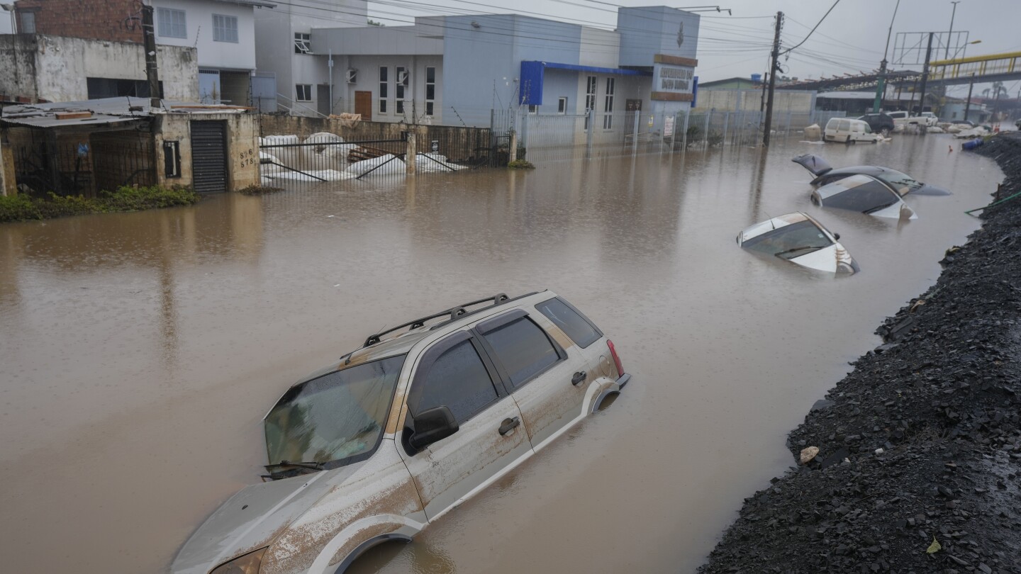 Brazil’s flooded south sees first death from disease, as experts warn of coming surge in fatalities