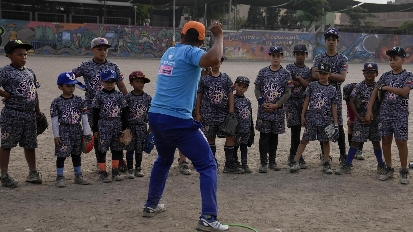 Baseball becomes a shelter for Venezuelan children in soccer-mad Peru