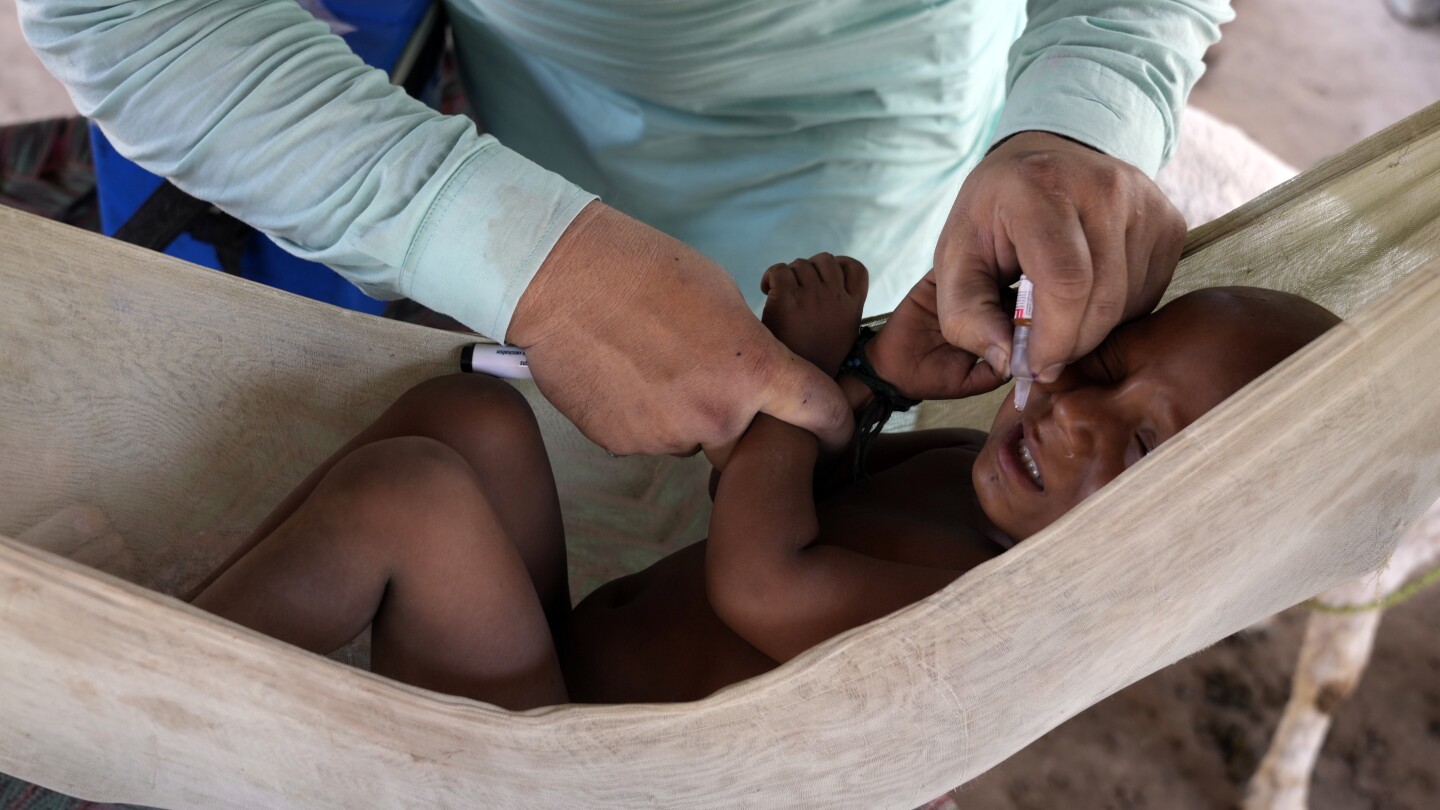Gunmen kill a police officer assigned to protect polio workers in Pakistan’s northwest