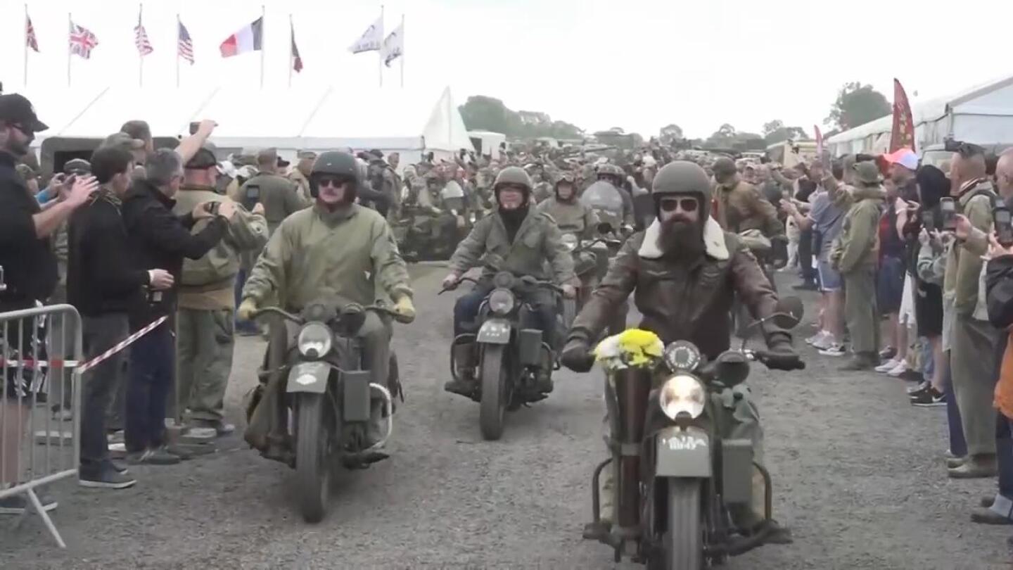 US army vintage Harley Davidson motorbikes take part in a road parade near D-Day landing beaches | AP News