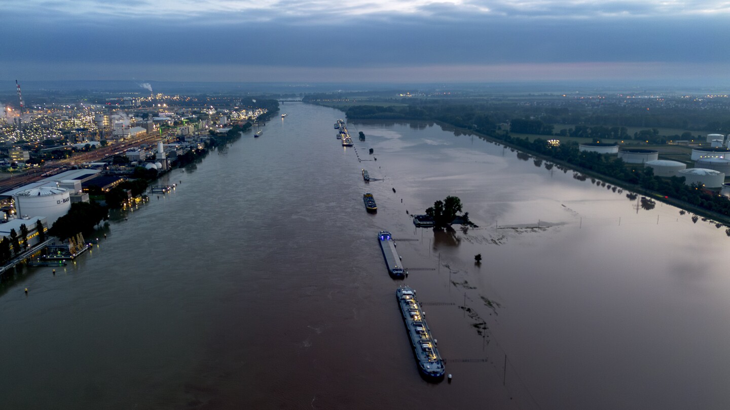 Body of a 5th victim is recovered from a submerged car after flooding in Germany