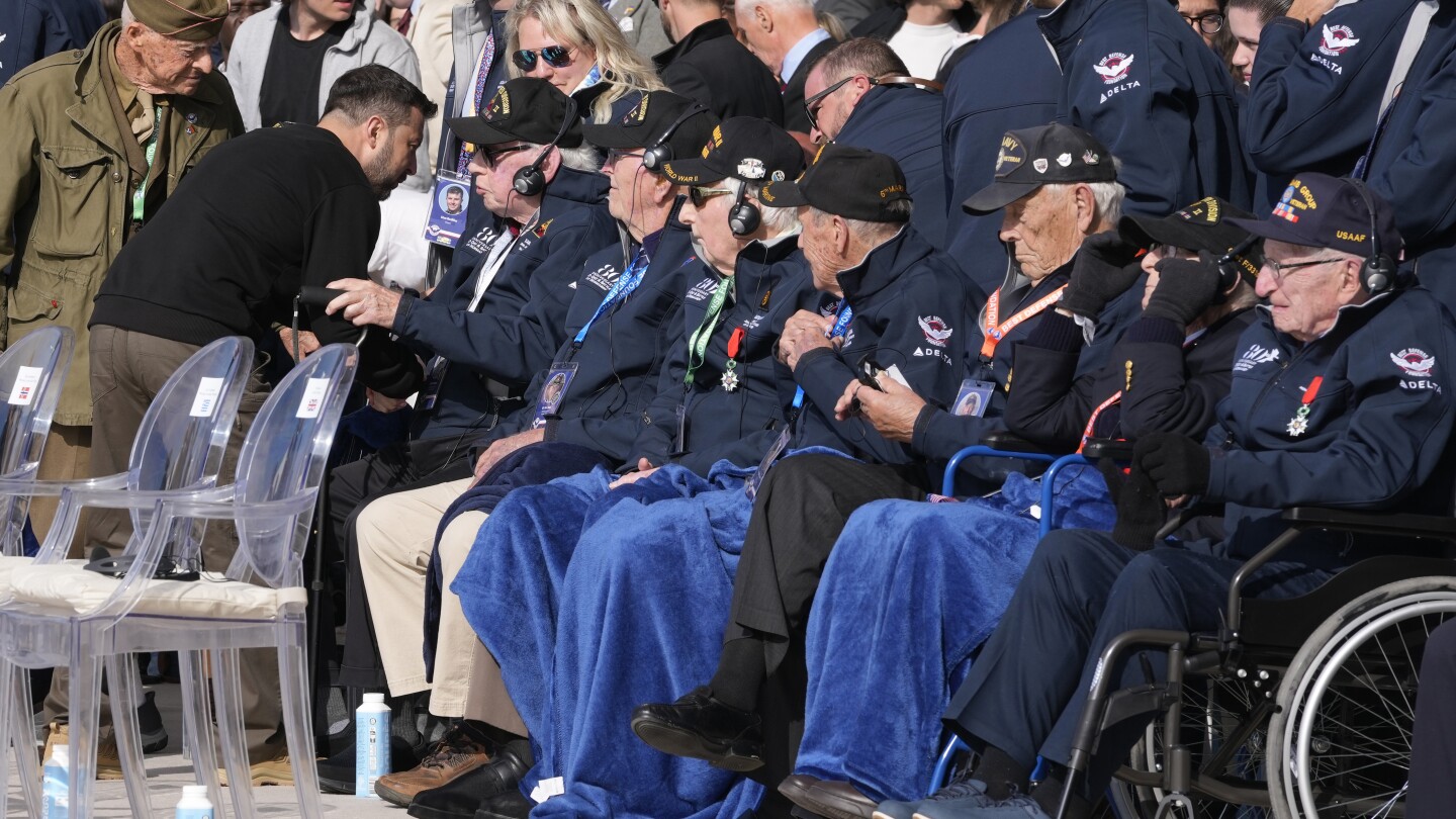 At D-Day ceremony, American veteran hugs Ukraine’s Zelenskyy and calls him a savior